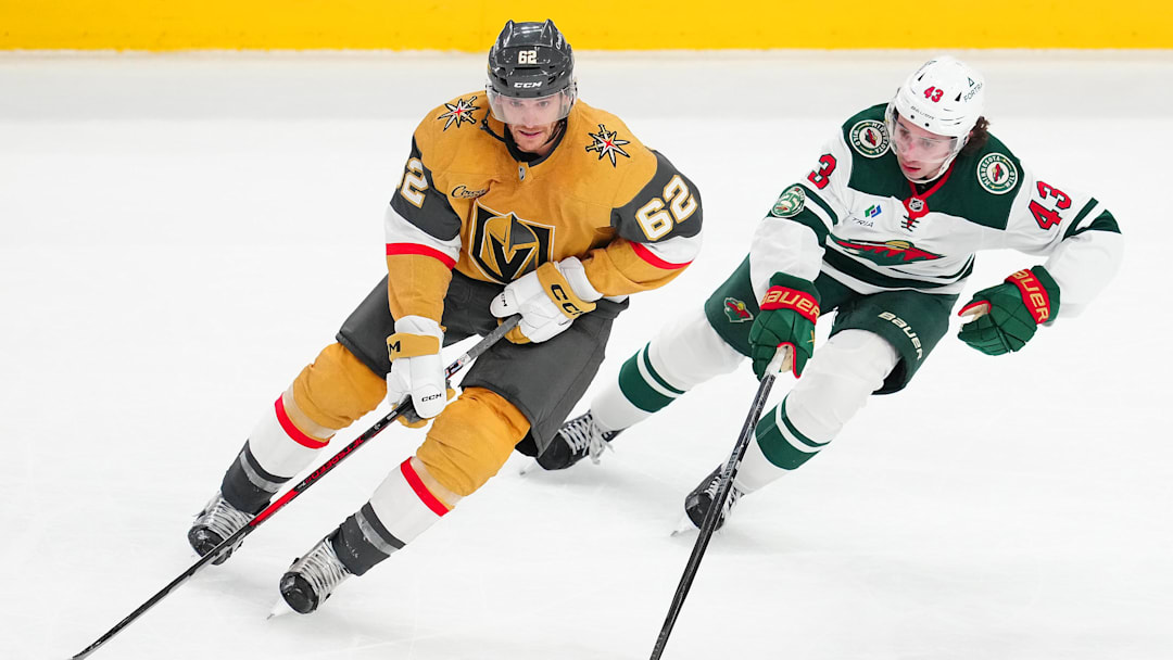 Newly-acquired center Nic Dowd skates alongside Quinn Hughes during the game.