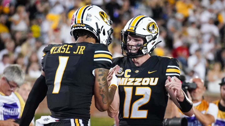 Sep 9, 2023; Columbia, Missouri, USA; Missouri Tigers wide receiver Theo Wease Jr. (1) celebrates with quarterback Brady Cook (12) after Wease   s touchdown against the Middle Tennessee Blue Raiders during the second half at Faurot Field at Memorial Stadium. Mandatory Credit: Denny Medley-USA TODAY Sports