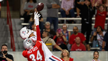 Aug 31, 2024; Tucson, Arizona, USA; New Mexico safety Noa Pola-Gates (34) deflects catch from Arizona Wildcats wide receiver Tetairoa McMillan (34) during fourth quarter at Arizona Stadium. Mandatory Credit: Aryanna Frank-Imagn Images