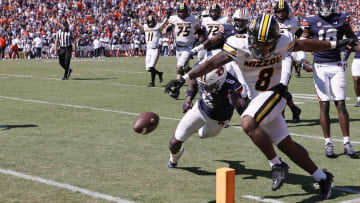 Sep 24, 2022; Auburn, Alabama, USA;  Missouri Tigers running back Nathaniel Peat (8) is hit by Auburn Tigers cornerback Keionte Scott (6) and fumbles the ball before crossing the goal line during the first overtime at Jordan-Hare Stadium.  Auburn recovered the fumble in the end zone to win the game. Mandatory Credit: John Reed-USA TODAY Sports