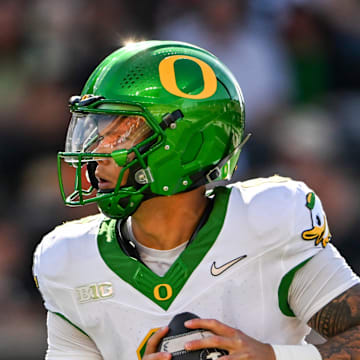 Oregon Ducks quarterback Dillon Gabriel (8) looks for an opening during the second half of the annual rivalry game against the Oregon State Beavers on Saturday, Sept. 14, 2024 at Reser Stadium in Corvallis, Ore.