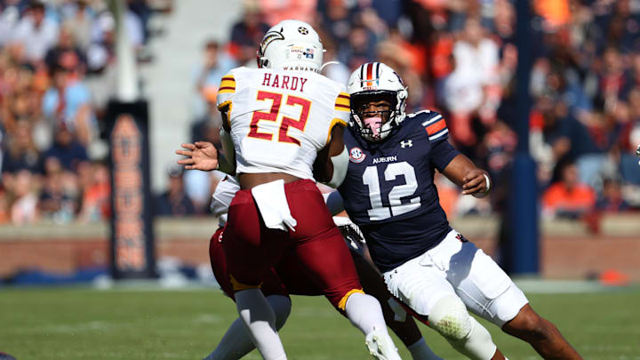 Nov 16, 2024; Auburn, Alabama, USA; Auburn Tigers linebacker Dorian Mausi Jr. (12) closes in on Louisiana Monroe Warhawks running back Ahmad Hardy (22) during the first quarter at Jordan-Hare Stadium. Mandatory Credit: John Reed-Imagn Images