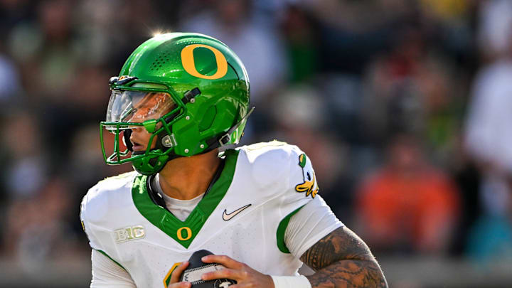 Oregon Ducks quarterback Dillon Gabriel (8) looks for an opening during the second half of the annual rivalry game against the Oregon State Beavers on Saturday, Sept. 14, 2024 at Reser Stadium in Corvallis, Ore.