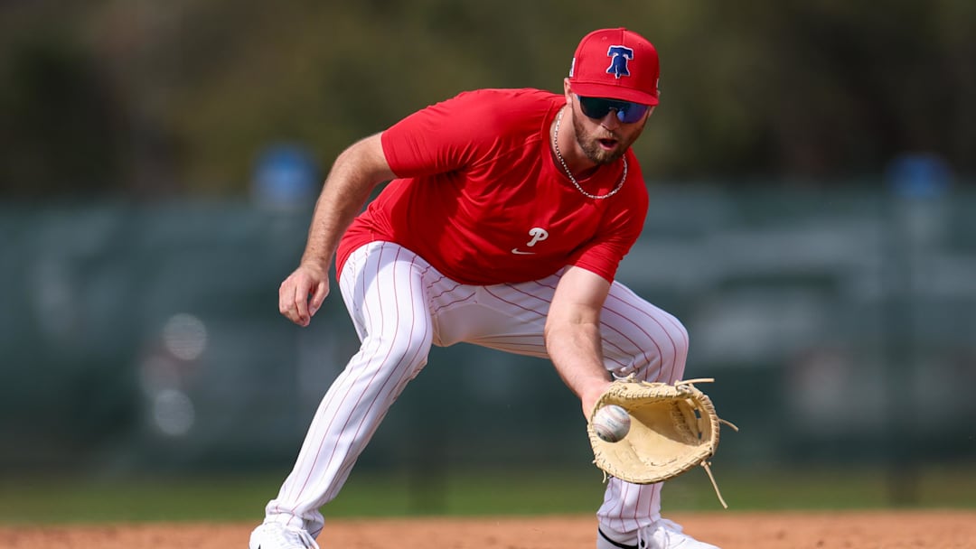 Feb 19, 2025; Clearwater, FL, USA; Philadelphia Phillies first base Kody Clemens (2) takes fielding practice during spring training workouts at BayCare Ballpark. Mandatory Credit: Nathan Ray Seebeck-Imagn Images