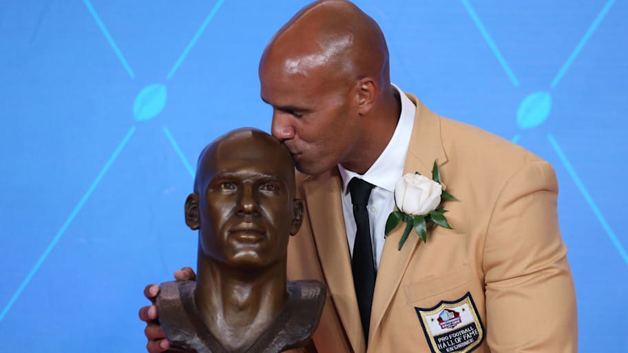 Miami Dolphins former linebacker Jason Taylor reacts with his bust during the Professional Football HOF enshrinement ceremonies at the Tom Benson Hall of Fame Stadium in 2017. | Charles LeClaire-USA TODAY Sports