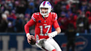 Dec 22, 2024; Orchard Park, New York, USA; Buffalo Bills quarterback Josh Allen (17) runs out of the pocket in the fourth quarter against the New England Patriots at Highmark Stadium. 