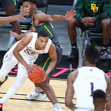 Former Huskies guard Quade Green (55) splits the Baylor defense during a game played in Las Vegas in 2020.