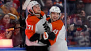 Jan 24, 2025; Elmont, New York, USA; Philadelphia Flyers right wing Tyson Foerster (71) celebrates his goal against the New York Islanders with center Morgan Frost (48) during the first period at UBS Arena. Mandatory Credit: Brad Penner-Imagn Images