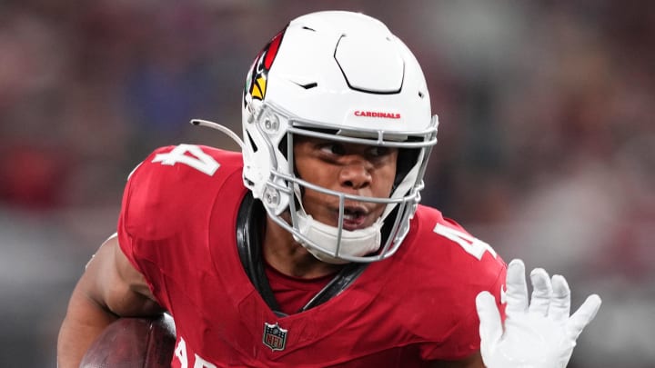 Jan 7, 2024; Glendale, Arizona, USA; Arizona Cardinals wide receiver Rondale Moore (4) runs against the Seattle Seahawks during the second half at State Farm Stadium. Mandatory Credit: Joe Camporeale-USA TODAY Sports