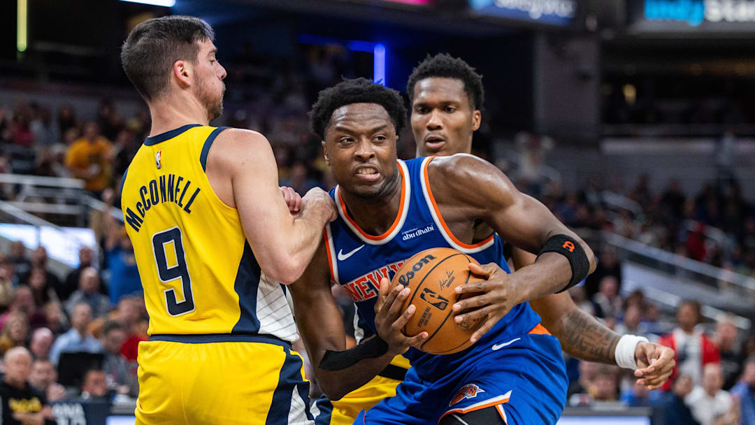 Nov 10, 2024; Indianapolis, Indiana, USA;  New York Knicks forward OG Anunoby (8) looks to pass the ball while  Indiana Pacers guard T.J. McConnell (9) defends in the second half at Gainbridge Fieldhouse. Mandatory Credit: Trevor Ruszkowski-Imagn Images