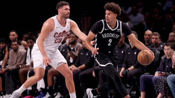 Oct 25, 2023; Brooklyn, New York, USA; Brooklyn Nets forward Cameron Johnson (2) controls the ball against Cleveland Cavaliers forward Georges Niang (20) during the second quarter at Barclays Center. Mandatory Credit: Brad Penner-USA TODAY Sports