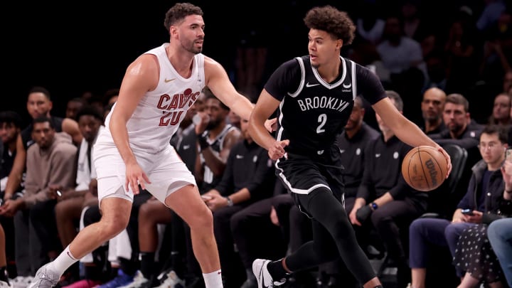 Oct 25, 2023; Brooklyn, New York, USA; Brooklyn Nets forward Cameron Johnson (2) controls the ball against Cleveland Cavaliers forward Georges Niang (20) during the second quarter at Barclays Center. Mandatory Credit: Brad Penner-USA TODAY Sports