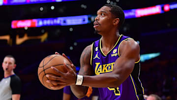 Apr 7, 2023; Los Angeles, California, USA; Los Angeles Lakers guard Lonnie Walker IV (4) shoots against the Phoenix Suns during the first half at Crypto.com Arena. Mandatory Credit: Gary A. Vasquez-Imagn Images