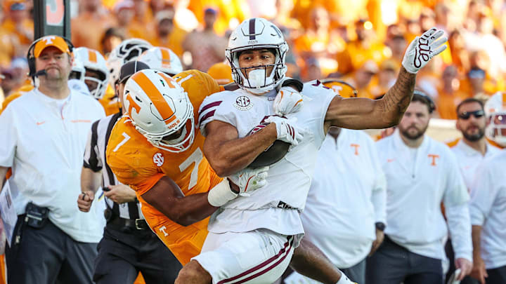 Sep 27, 2025; Starkville, Mississippi, USA; Mississippi State Bulldogs running back Davon Booth (6) is tackled by Tennessee Volunteers linebacker Arion Carter (7) during the second half at Davis Wade Stadium at Scott Field. Mandatory Credit: Wesley Hale-Imagn Images