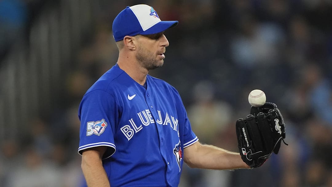 Apr 12, 2026; Toronto, Ontario, CAN; Toronto Blue Jays starting pitcher Max Scherzer (31) flips a ball out of his glove before throwing a pitch to the Minnesota Twins during the second inning at Rogers Centre. Mandatory Credit: John E. Sokolowski-Imagn Images Apr 12, 2026; Toronto, Ontario, CAN; Toronto Blue Jays starting pitcher Max Scherzer (31) flips a ball out of his glove before throwing a pitch to the Minnesota Twins during the second inning at Rogers Centre. Mandatory Credit: John E. Sokolowski-Imagn Images