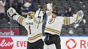 Apr 24, 2024; Toronto, Ontario, CAN; Boston Bruins goaltender Linus Ullmark (right) congratulates goaltender Jeremy Swayman (1) on a win over the Toronto Maple Leafs in game three of the first round of the 2024 Stanley Cup Playoffs at Scotiabank Arena. Mandatory Credit: John E. Sokolowski-Imagn Images
