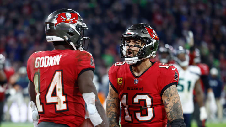 Nov 13, 2022; Munich, Germany, DEU; Tampa Bay Buccaneers wide receiver Chris Godwin (14) celebrates his touchdown with teammate wide receiver Mike Evans (13) against the Seattle Seahawks during the fourth quarter of an International Series game at Allianz Arena. Mandatory Credit: Douglas DeFelice-USA TODAY Sports