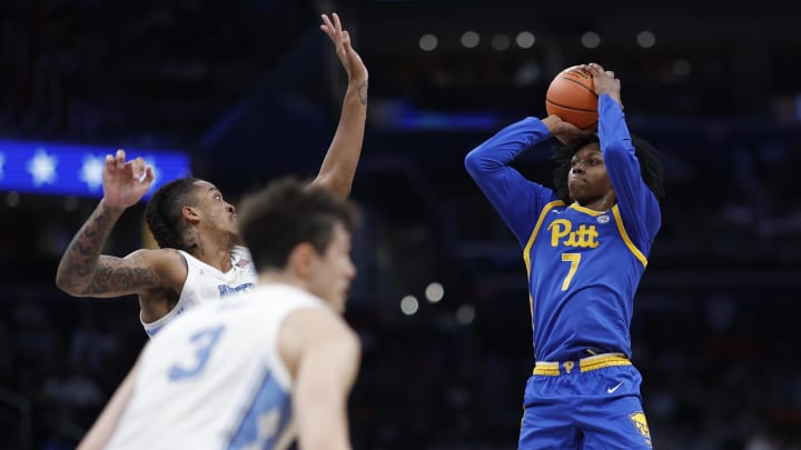 Mar 15, 2024; Washington, D.C., USA; Pittsburgh Panthers guard Carlton Carrington (7) shoots the ball as North Carolina Tar Heels forward Armando Bacot (5) defends in the first half at Capital One Arena. Mandatory Credit: Geoff Burke-USA TODAY Sports Mar 15, 2024; Washington, D.C., USA; Pittsburgh Panthers guard Carlton Carrington (7) shoots the ball as North Carolina Tar Heels forward Armando Bacot (5) defends in the first half at Capital One Arena. Mandatory Credit: Geoff Burke-USA TODAY Sports