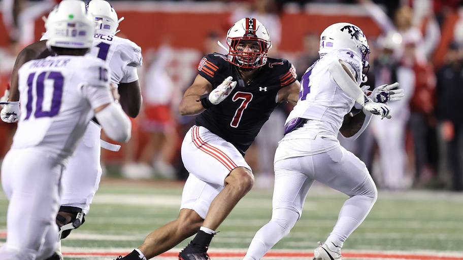 Utah Utes defensive end Van Fillinger defends TCU Horned Frogs running back Cam Cook.