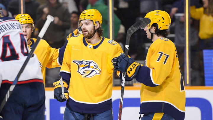 Apr 13, 2024; Nashville, Tennessee, USA; Nashville Predators center Tommy Novak (82) celebrates his goal against the Columbus Blue Jackets during the first period at Bridgestone Arena. Mandatory Credit: Steve Roberts-USA TODAY Sports