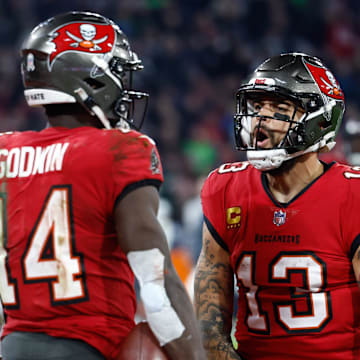 Nov 13, 2022; Munich, Germany, DEU; Tampa Bay Buccaneers wide receiver Chris Godwin (14) celebrates his touchdown with teammate wide receiver Mike Evans (13) against the Seattle Seahawks during the fourth quarter of an International Series game at Allianz Arena. Mandatory Credit: Douglas DeFelice-Imagn Images