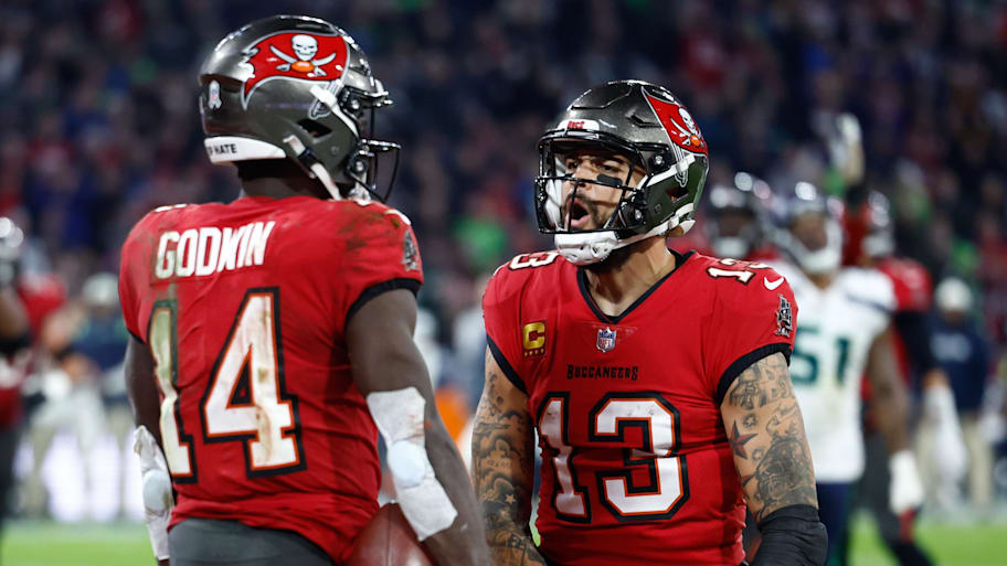 Nov 13, 2022; Munich, Germany, DEU; Tampa Bay Buccaneers wide receiver Chris Godwin (14) celebrates his touchdown with teammate wide receiver Mike Evans (13) against the Seattle Seahawks during the fourth quarter of an International Series game at Allianz Arena. Mandatory Credit: Douglas DeFelice-Imagn Images | Douglas DeFelice-Imagn Images
