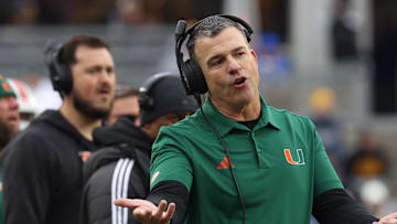 Nov 29, 2025; Pittsburgh, Pennsylvania, USA;  Miami Hurricanes head coach Mario Cristobal reacts on the sidelines against the Pittsburgh Panthers during the third quarter at Acrisure Stadium. Mandatory Credit: Charles LeClaire-Imagn Images