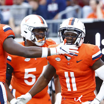 Aug 31, 2024; Charlottesville, Virginia, USA; Virginia Cavaliers wide receiver Trell Harris (11) celebrates with Cavaliers running back Kobe Pace (5) after scoring a touchdown against the Richmond Spiders during the first half at Scott Stadium. Mandatory Credit: Amber Searls-Imagn Images