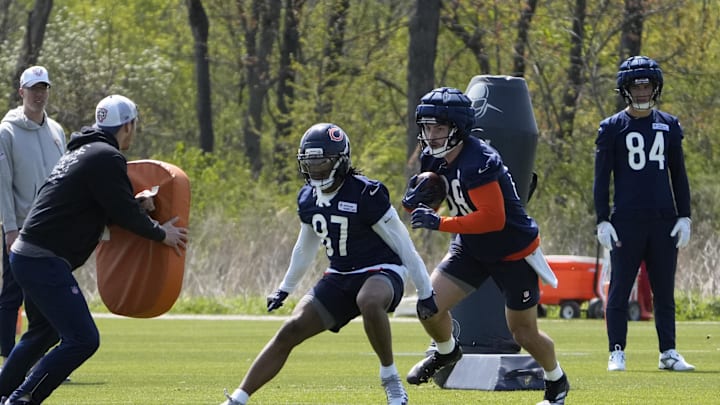 Wide receiver Luther Burden III (87) prepares to block for a receiver during a drill at Bears rookie camp. Wide receiver Luther Burden III (87) prepares to block for a receiver during a drill at Bears rookie camp.