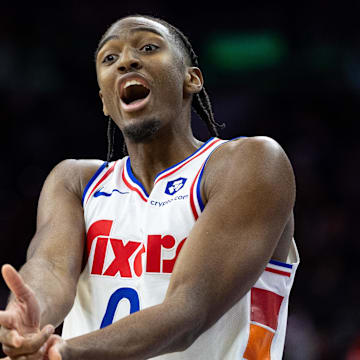 Dec 23, 2024; Philadelphia, Pennsylvania, USA; Philadelphia 76ers guard Tyrese Maxey (0) reacts to his three pointer in the closing moments of the game against the San Antonio Spurs at Wells Fargo Center. Mandatory Credit: Bill Streicher-Imagn Images