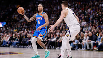 Dec 29, 2023; Denver, Colorado, USA; Oklahoma City Thunder forward Jaylin Williams (6) passes the ball as Denver Nuggets center Nikola Jokic (15) guards in the second quarter at Ball Arena. Mandatory Credit: Isaiah J. Downing-Imagn Images
