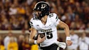 Purdue Boilermakers quarterback Ryan Browne (15) runs the ball 