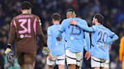 Manuel Akanji leaves the field with Bernardo Silva