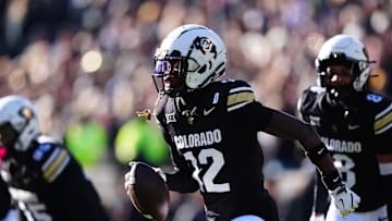 Nov 29, 2024; Boulder, Colorado, USA; Colorado Buffaloes cornerback Travis Hunter (12) following an interception in the first quarter against the Oklahoma State Cowboys  at Folsom Field. Mandatory Credit: Ron Chenoy-Imagn Images