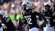 Nov 29, 2024; Boulder, Colorado, USA; Colorado Buffaloes cornerback Travis Hunter (12) following an interception in the first quarter against the Oklahoma State Cowboys  at Folsom Field. Mandatory Credit: Ron Chenoy-Imagn Images