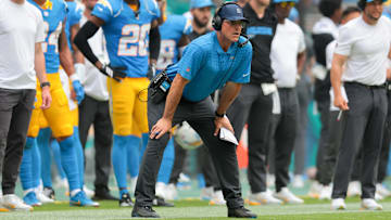 Los Angeles Chargers head coach Jim Harbaugh watches from the sideline against the Miami Dolphins