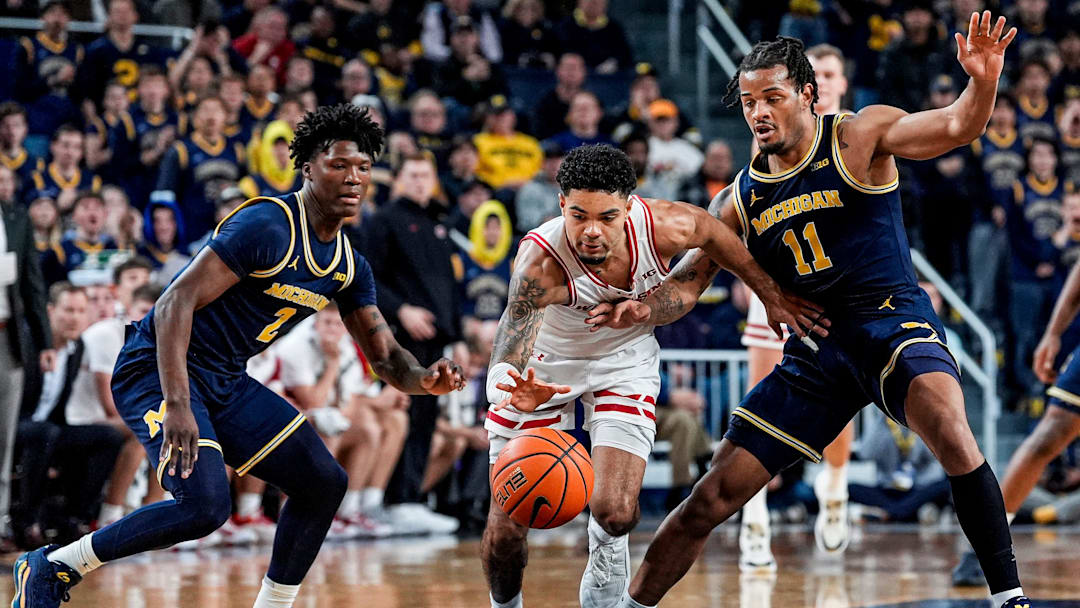 Michigan guard L.J.Cason (2) and guard Roddy Gayle Jr. (11) defend Wisconsin guard Nick Boyd (2) during the second half at Crisler Center in Ann Arbor on Saturday, Jan. 10, 2026.