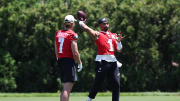May 30, 2024; Philadelphia, PA, USA; Philadelphia Eagles quarterback Jalen Hurts (1) throws the ball in front of quarterback Kenny Pickett (7) at NovaCare Complex. Mandatory Credit: Bill Streicher-USA TODAY Sports