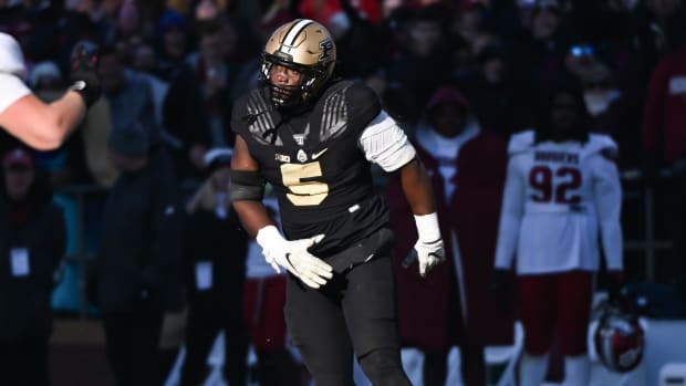 Nov 25, 2023; West Lafayette, Indiana, USA; Purdue Boilermakers linebacker Nic Scourton (5) reacts after bringing down Indian