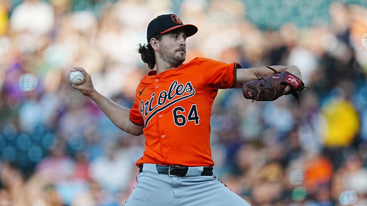 Aug 31, 2024; Denver, Colorado, USA; Baltimore Orioles starting pitcher Dean Kremer (64) delivers a pitch in the first inning against the Colorado Rockies at Coors Field. 