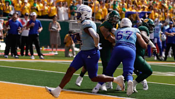 Oct 22, 2022; Waco, Texas, USA;  Kansas Jayhawks running back Devin Neal (4) scores a touchdown against the Baylor Bears in the second half at McLane Stadium. Mandatory Credit: Chris Jones-Imagn Images