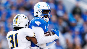 Nov 16, 2024; Lexington, Kentucky, USA; Murray State Racers defensive back James Jackson tackles Kentucky Wildcats wide receiver Hardley Gilmore IV (17) during the second quarter at Kroger Field. Mandatory Credit: Jordan Prather-Imagn Images