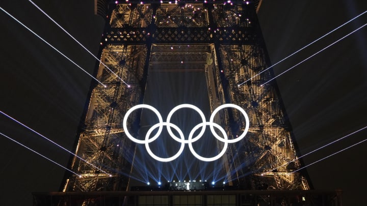 Jul 26, 2024; Paris, FRANCE;  Celine Dion performs under the Olympic rings on the Eiffel Tower during the Opening Ceremony for the Paris 2024 Olympic Summer Games along the Seine River. Mandatory Credit: Andrew P. Scott-USA TODAY Sports