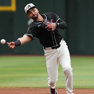 May 17, 2025; Phoenix, Arizona, USA; Arizona Diamondbacks second baseman Jordan Lawlar (10) throws to first against the Colorado Rockies in the second inning at Chase Field. Mandatory Credit: Jacob Reiner-Imagn Images