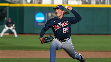 Jun 20, 2022; Omaha, NE, USA;  Ole Miss Rebels starting pitcher Hunter Elliott (26) throws against the Arkansas Razorbacks in the first inning at Charles Schwab Field. Mandatory Credit: Steven Branscombe-Imagn Images