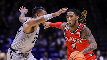 Jan 7, 2025; Cincinnati, Ohio, USA; St. John's basketball guard Deivon Smith (5) dribbles against Xavier Musketeers guard Dayvion McKnight (20) in the second half at Cintas Center. 