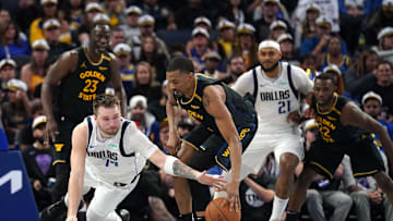 Nov 12, 2024; San Francisco, California, USA; Dallas Mavericks guard Luka Doncic (77) loses control of the ball next to Golden State Warriors guard De'Anthony Melton (8) in the fourth quarter at the Chase Center. Mandatory Credit: Cary Edmondson-Imagn Images