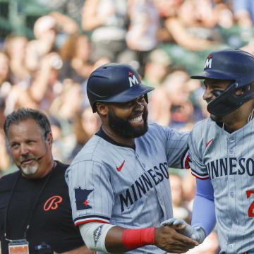 Minnesota Twins designated hitter Royce Lewis (23) celebrates with teammate Manuel Margot (13) after hitting a home run in the first inning against the Detroit Tigers at Comerica Park on July 27.