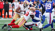 Nov 2, 2025; East Rutherford, New Jersey, USA; New York Giants quarterback Jaxson Dart (6) is tackled by San Francisco 49ers linebacker Tatum Bethune (48) during the second half at MetLife Stadium. Mandatory Credit: Ed Mulholland-Imagn Images