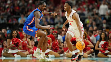Houston's LJ Cryer (right) against Florida in the national title game on April 7, 2025.